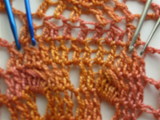 Closeup_with_hooks_showing_completed_dc2tog_stitches__small__small2