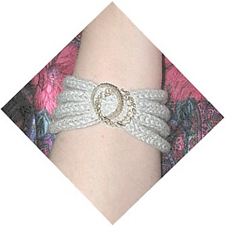Twocirclesbroochoverserpentinebracelet_small2